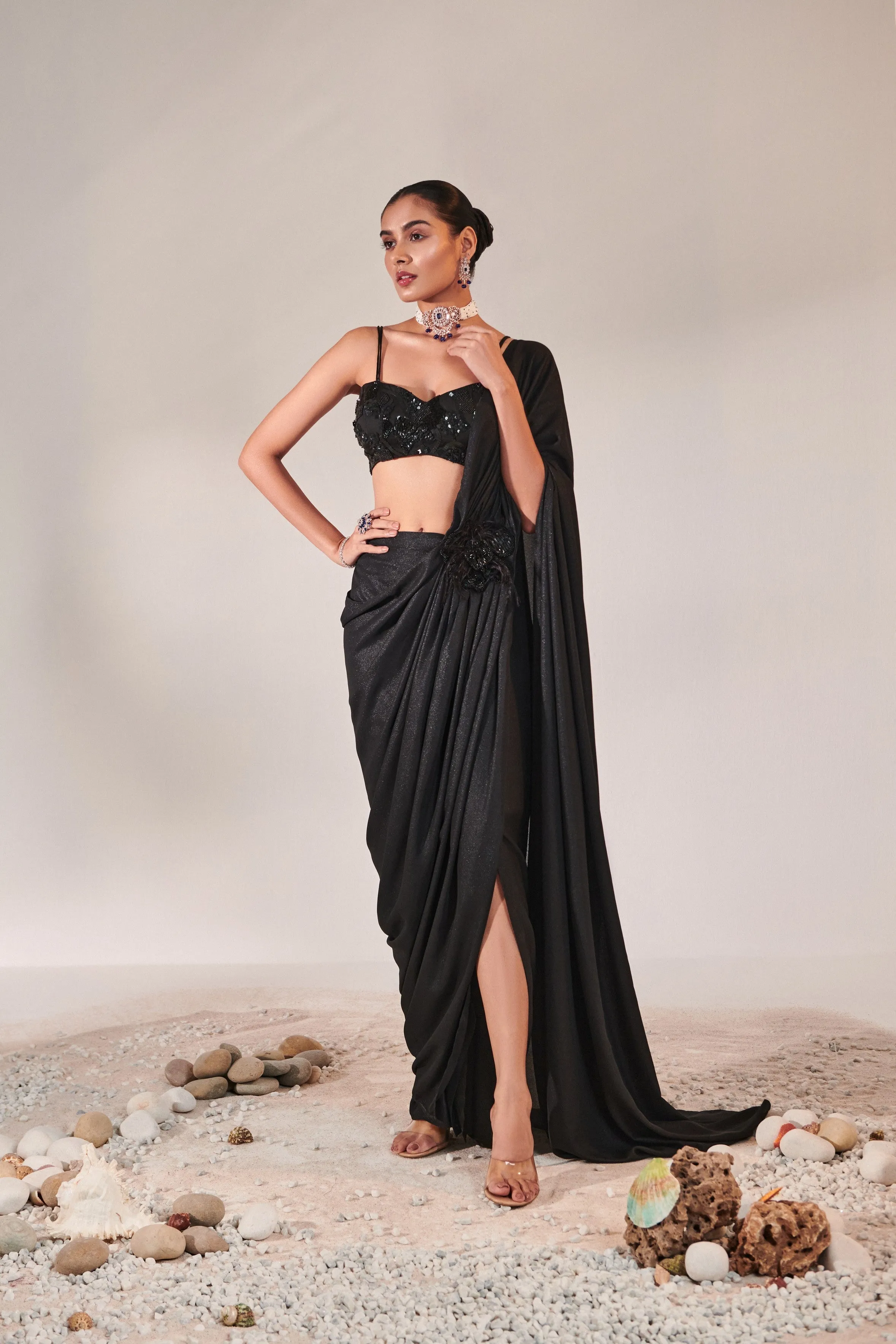 fuss-free pre-stitched drape saree; hand embroidered blouse and feather detailing